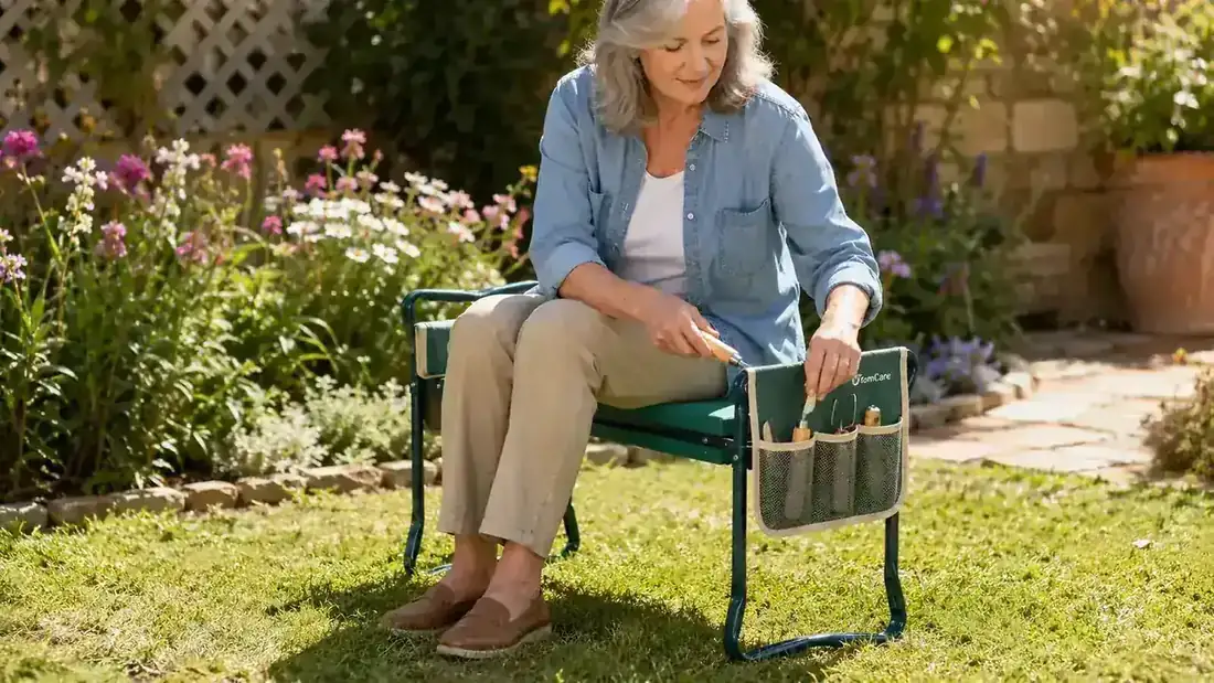 TomCare garden kneeler flipped upside down to function as a seat bench beside a vegetable garden
